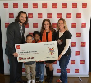 (Far Left) San Francisco Giants shortstop Brandon Crawford presents a $3,000 check to proivde yoga equipment to Robert Semple Elementary, one of the recipients of Crawford's Step Up to the Plate Foundation. Standing next to Crawford are (Left to right) Robert Semple second graders Eli Chaney and Cairo DeCatur, teacher Chelsea Masters and Principal Christina Moore. (Courtesy photo)