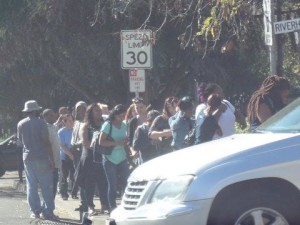 Hundreds line up on the corner of East Second Street and Riverhill Drive to get on a waiting list for affordable housing. (Photo by Elizabeth Warnimont)