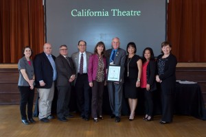 Beate Brühl (center) is pictured with Pittsburg Mayor Pete Longmire (holding the award) and others honored for their part in the restoration of the California Theatre in Pittsburg. (Photo courtesy of California State Parks)