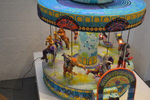 "When Ponies Dream," by Susan Else is a motorized carousel that spins around, lights up and plays music when turned on. (Photo by Nick Sestanovich)