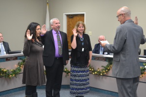 (Left to right) New Trustee Celeste Monnette and returning trustees Gary Wing and Stacy Holguin are sworn in at Thursday's meeting by Solano County Schools Superintendent Jay Speck. (Photo by Nick Sestanovich)