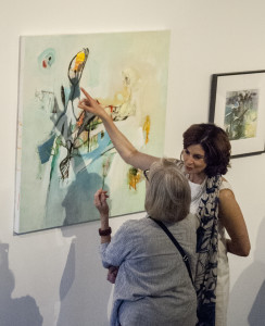 Brenda Colgate (Right) shows off a piece from her late mother Bea Guttman to former Arts Benicia Director Kathryn Weller Renfrow at the 2016 exhibit  "Forma Natura: Nature as a Source." Arts Benicia will turn 30 in 2017. (Photo courtesy of Mary Shaw)